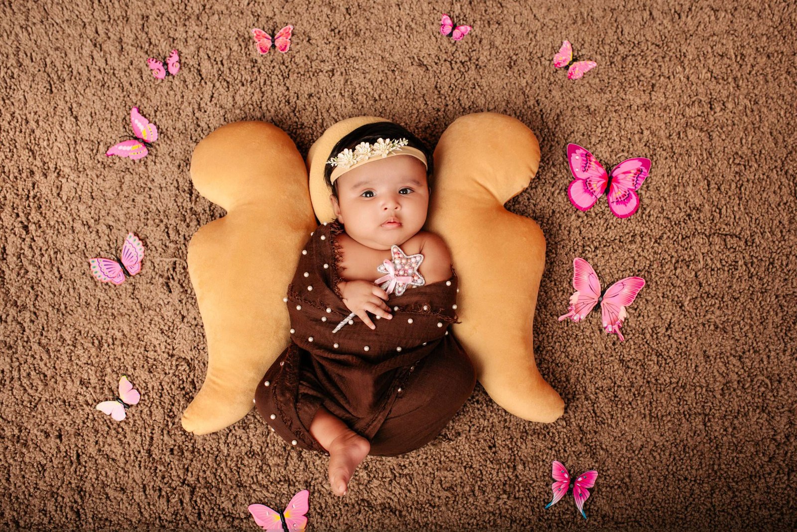 Newborn in wooden bowl